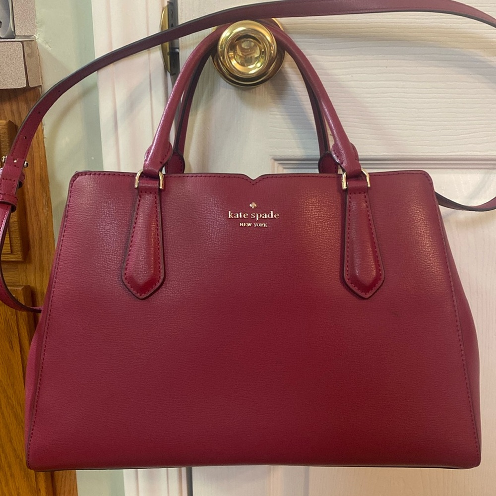 Kate Spade, New York burgundy/wine, color handbag with adjustable shoulder strap